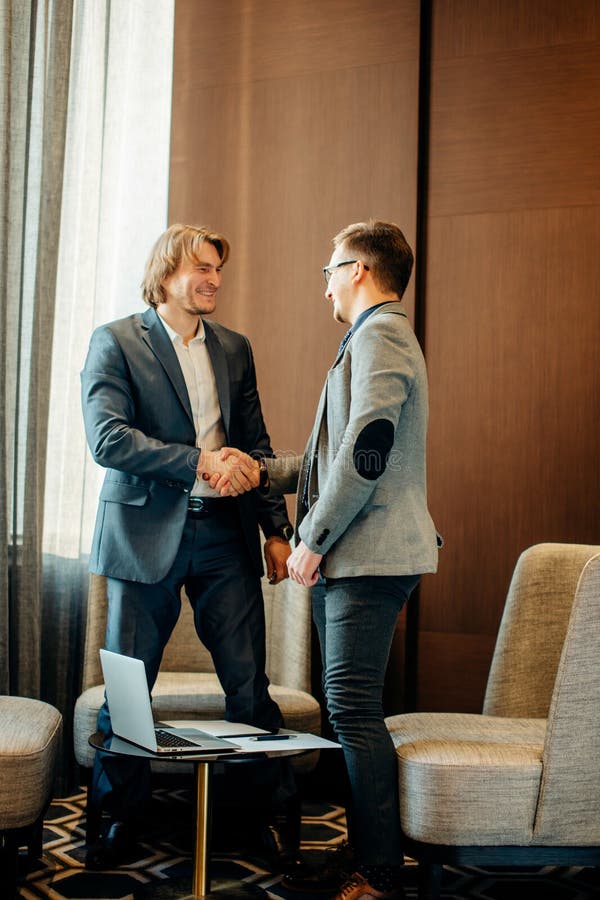 Business people shaking hands on meeting, great deal royalty free stock photography Business people shaking hands on meeting, great deal royalty free stock photography