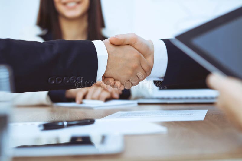 Business people shaking hands at meeting or negotiation in the office. Handshake concept. Partners are satisfied because royalty free stock photos Business people shaking hands at meeting or negotiation in the office. Handshake concept. Partners are satisfied because royalty free stock photos