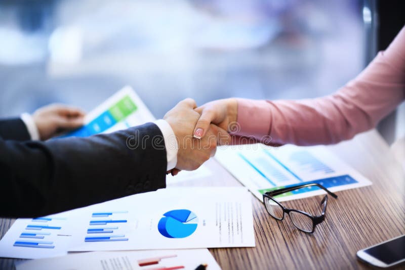 Business people shaking hands stock image