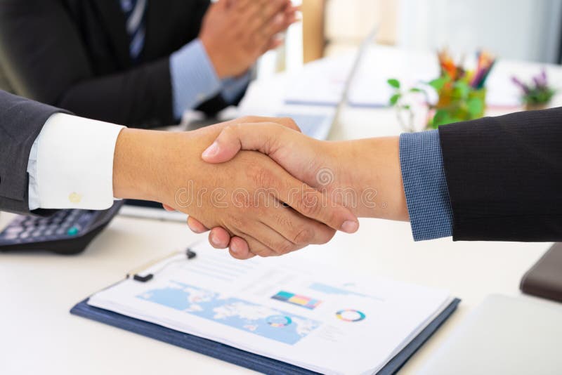 Business people shaking hands successful deal after great meeting. stock photo Business people shaking hands successful deal after great meeting. stock photo