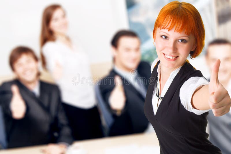 Business people showing thumbs up