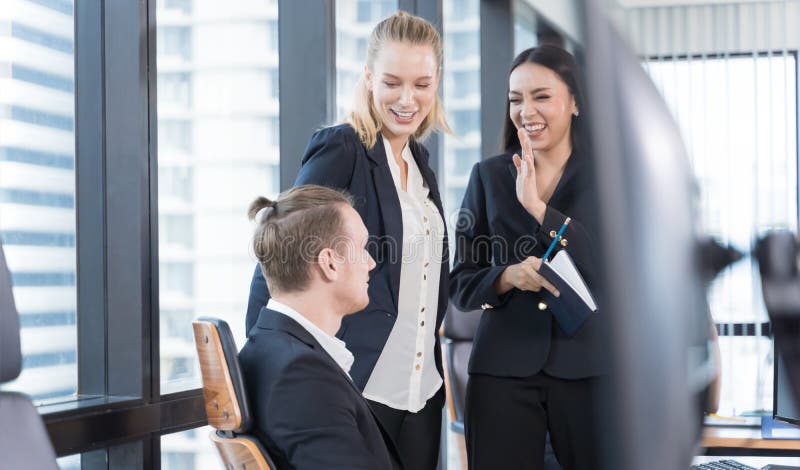 Business people on suit are meeting in office city building view. Group of friends talking. stock photography Business people on suit are meeting in office city building view. Group of friends talking. stock photography