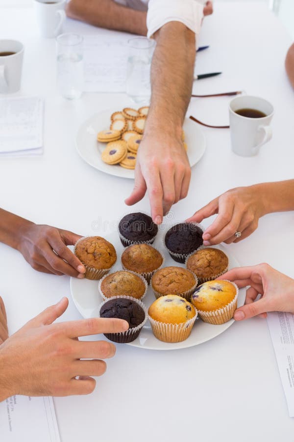 Business People Taking Muffins from Plate Stock Image Image of view, partners 40688019
