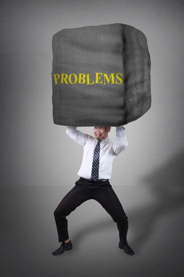 Business people under problems pressure, man holding heavy weight made of stone royalty free stock photography Business people under problems pressure, man holding heavy weight made of stone royalty free stock photography