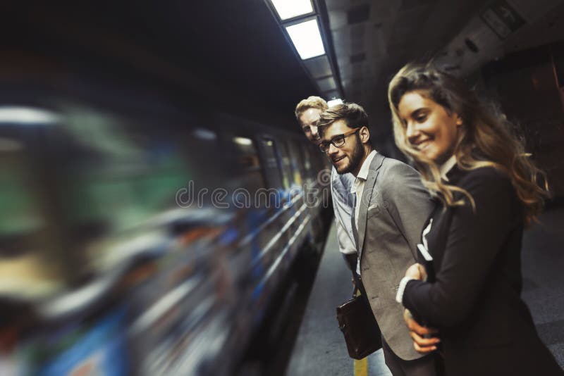 business people waiting for subway transportation underground