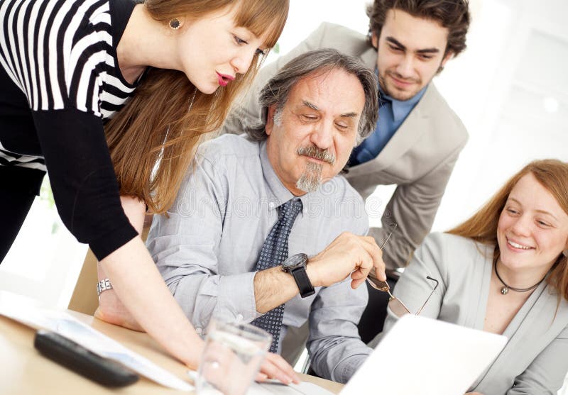 Business people working as a team at the office royalty free stock image Business people working as a team at the office royalty free stock image
