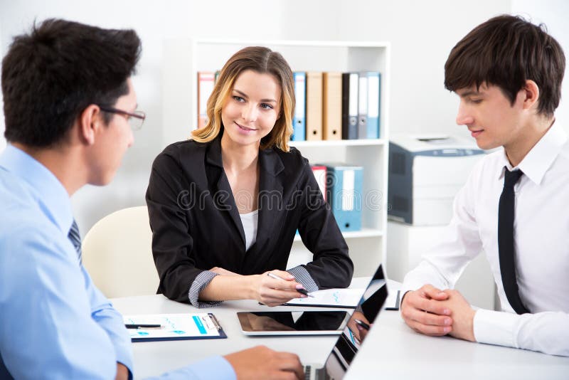 Business people working in an office stock image Business people working in an office stock image