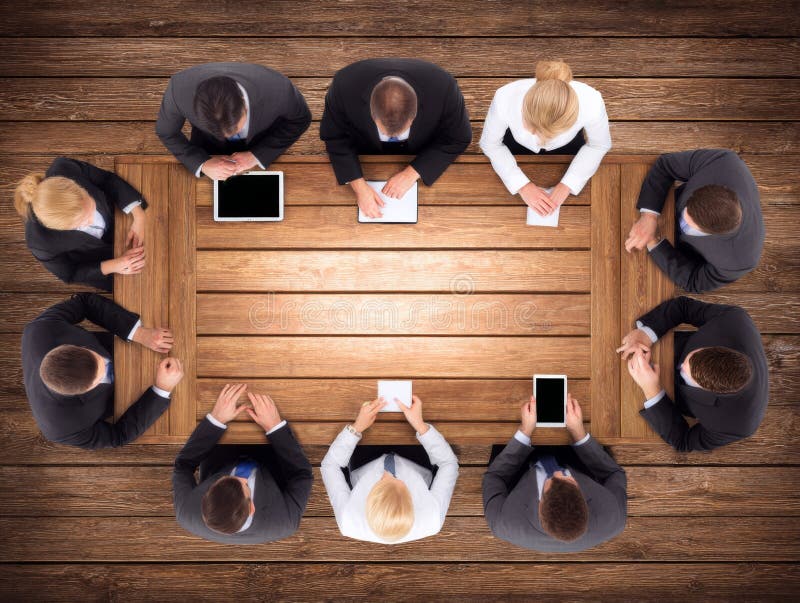 Business people working on laptops and tablets in meeting royalty free illustration