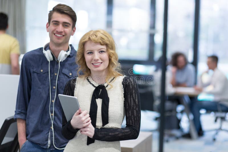 Business people working with tablet in startup office stock photography Business people working with tablet in startup office stock photography