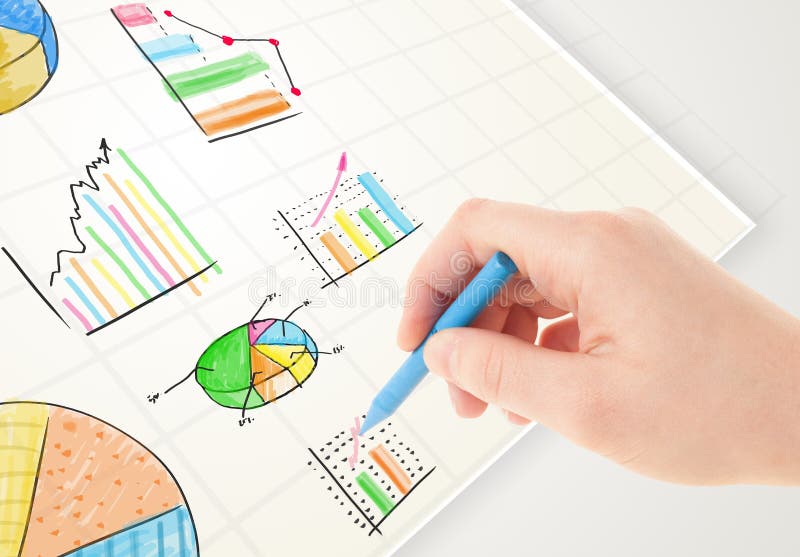 Business person drawing colorful graphs and icons on paper