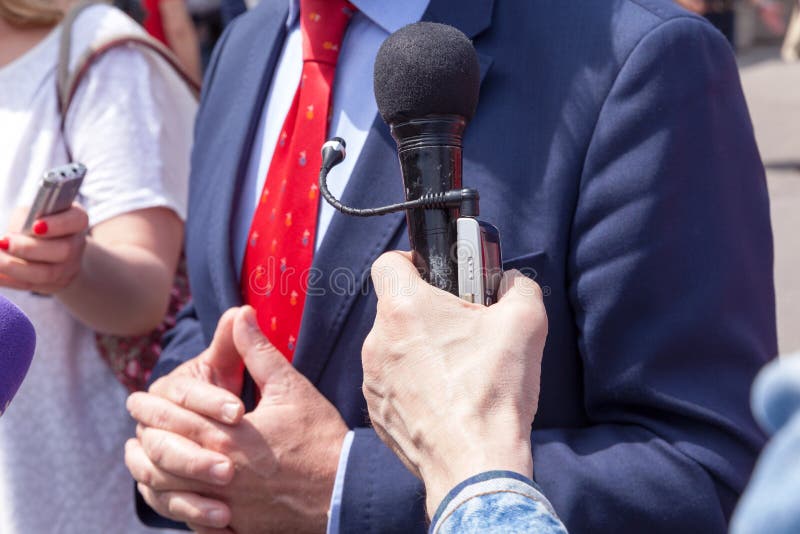 Businessman or politician gesturing, giving statement to the journalists. Business person or politician, with visible hand gestures, giving statement to the stock photos Businessman or politician gesturing, giving statement to the journalists. Business person or politician, with visible hand gestures, giving statement to the stock photos