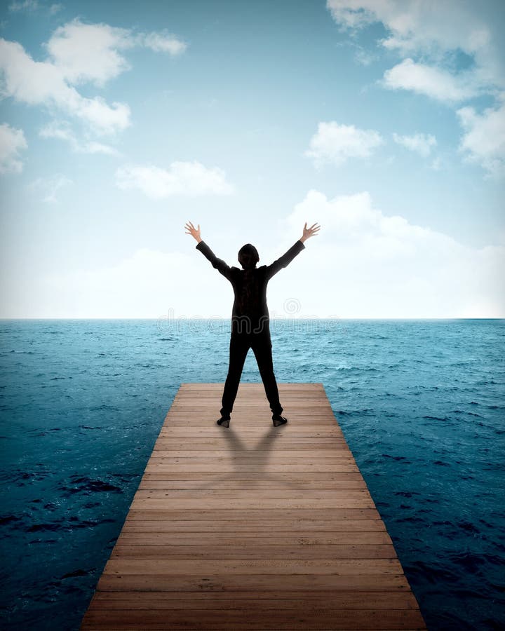 Business person standing on the wooden pier