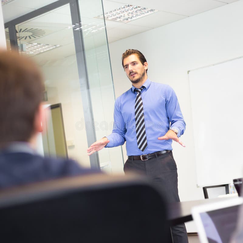 Smiling Businessman Talking To His Workmate Stock Photo - Image of ...