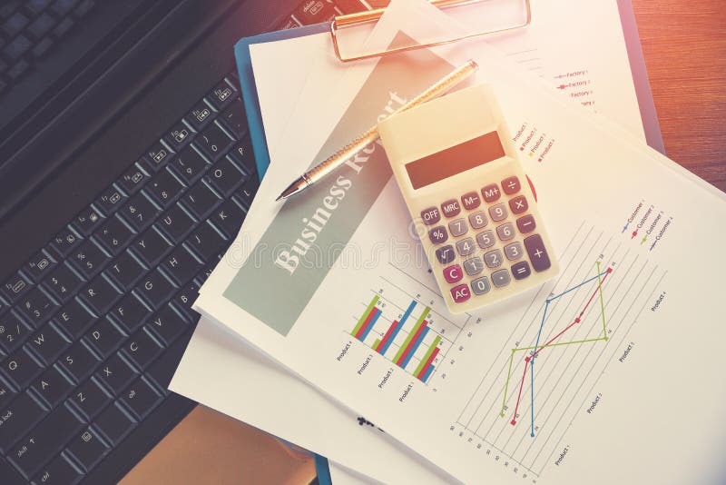 Business report chart preparing graphs calculator on laptop / Summary report in Statistics circle Pie chart on paper stock images Business report chart preparing graphs calculator on laptop / Summary report in Statistics circle Pie chart on paper stock images