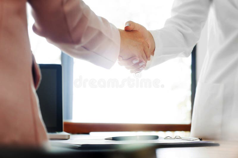 Business shaking hands at the office royalty free stock photos