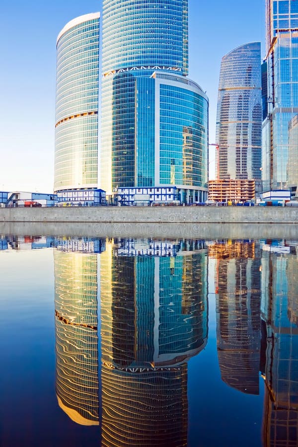 Business skyscrapers and reflections in the river