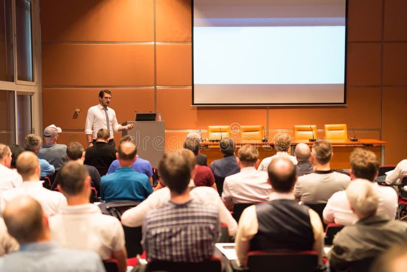 Business speaker giving a talk in conference hall. royalty free stock photo Business speaker giving a talk in conference hall. royalty free stock photo