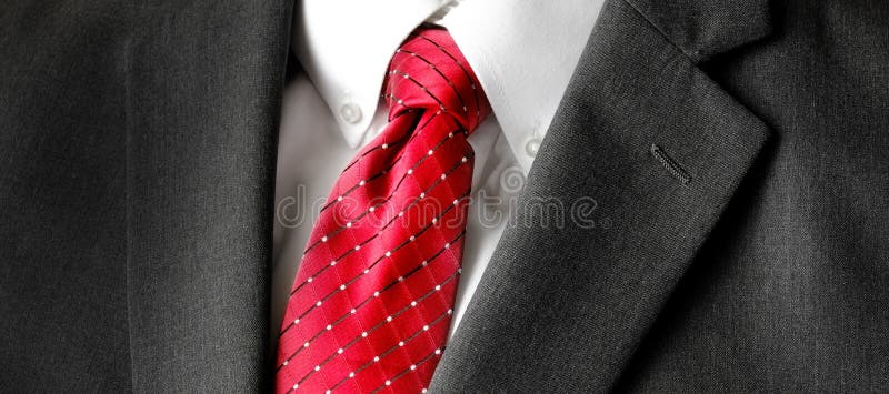 Man in white shirt, blue jacket and red tie Stock Photo