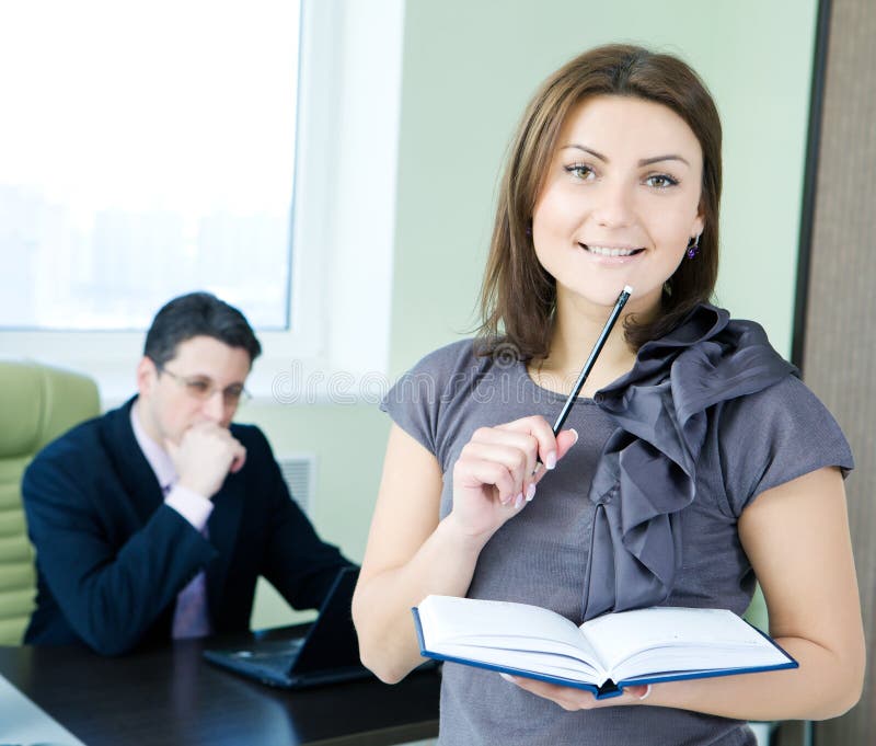 Business team - boss and assistant. royalty free stock photography