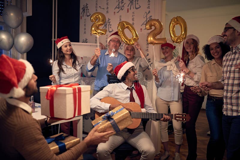 Business team celebrating new 2020 year in office royalty free stock images Business team celebrating new 2020 year in office royalty free stock images