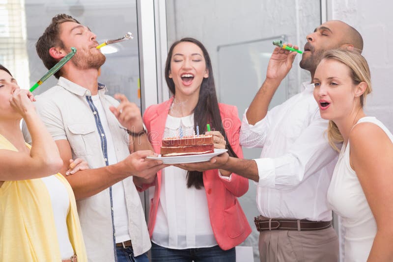 Business team celebrating with party horns royalty free stock image Business team celebrating with party horns royalty free stock image
