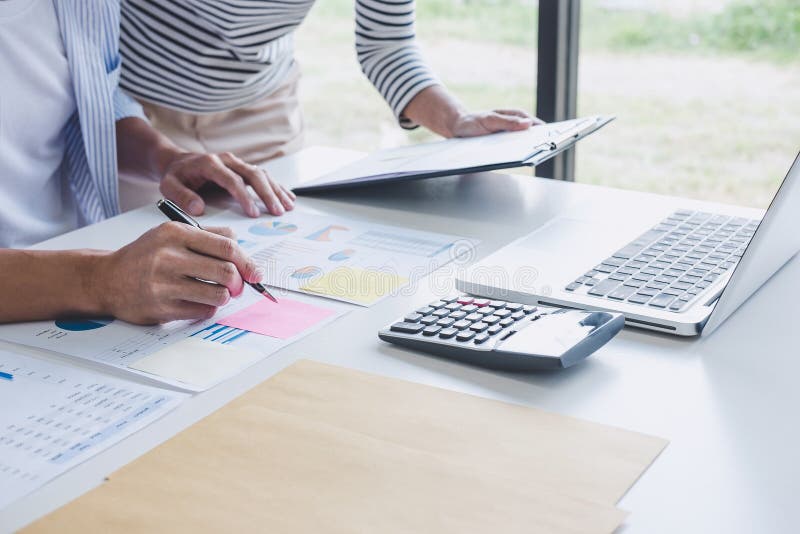 Business team collaboration discussing working analysis with financial data and marketing growth report graph in team, Meeting stock image