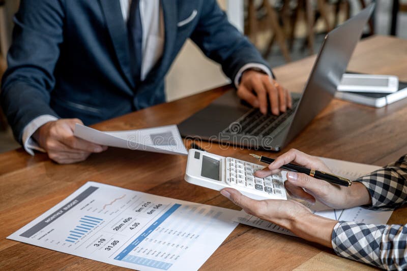 Business team collaboration discussing working analysis with financial data and marketing growth report graph in team to making royalty free stock image