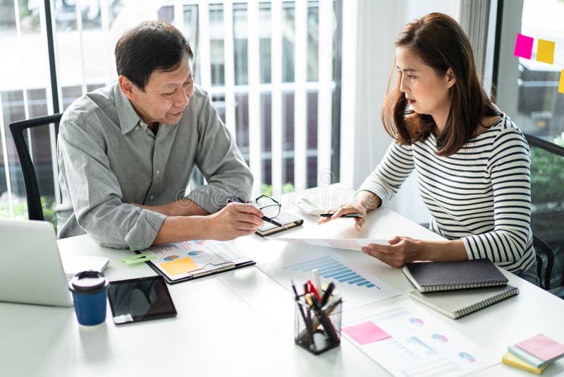 Business team colleagues consultation and discussion marketing plan meeting on the financial report and analyzing investment royalty free stock image