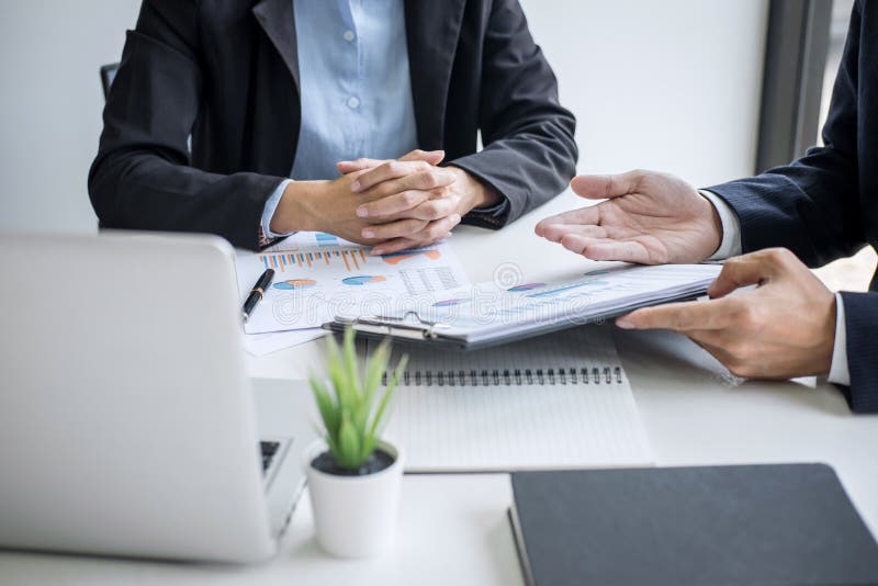 Business team colleagues discussing working analyzing with financial data and marketing growth report graph in team consultation stock photo