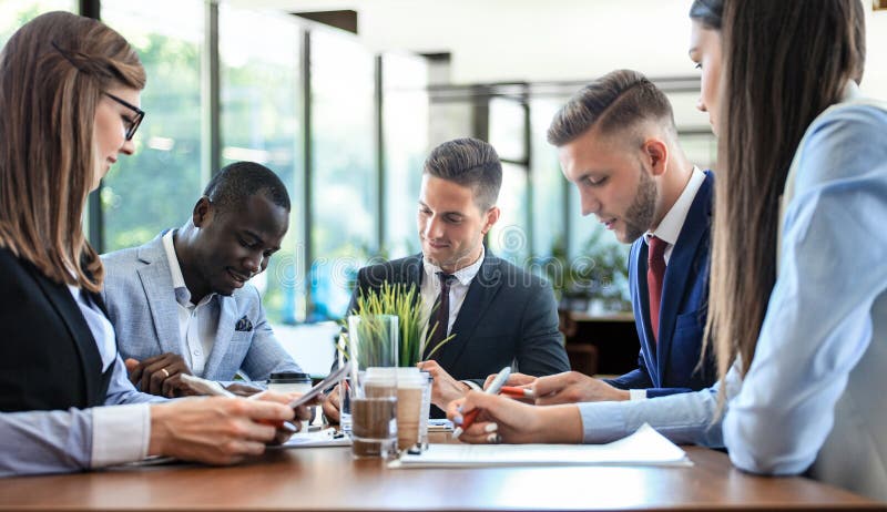 Business team discussing together business plans in office stock photos