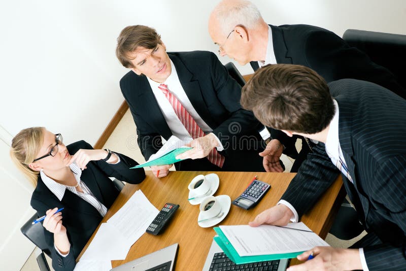 Business Team discussing various proposals