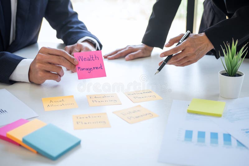 Business team executive accounting analyzing and calculation on valuation data investment fund looking at report, sticky note paper and having a consultation, Wealth Management and investment concept