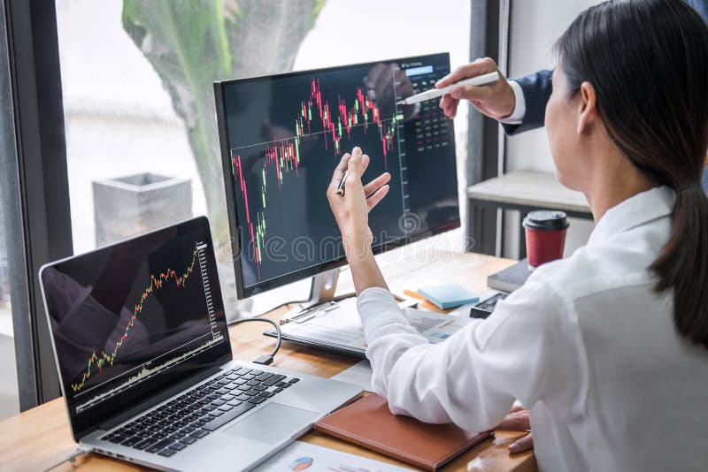 Business team investment working with computer, planning and analyzing graph stock market trading with stock chart data, business stock image
