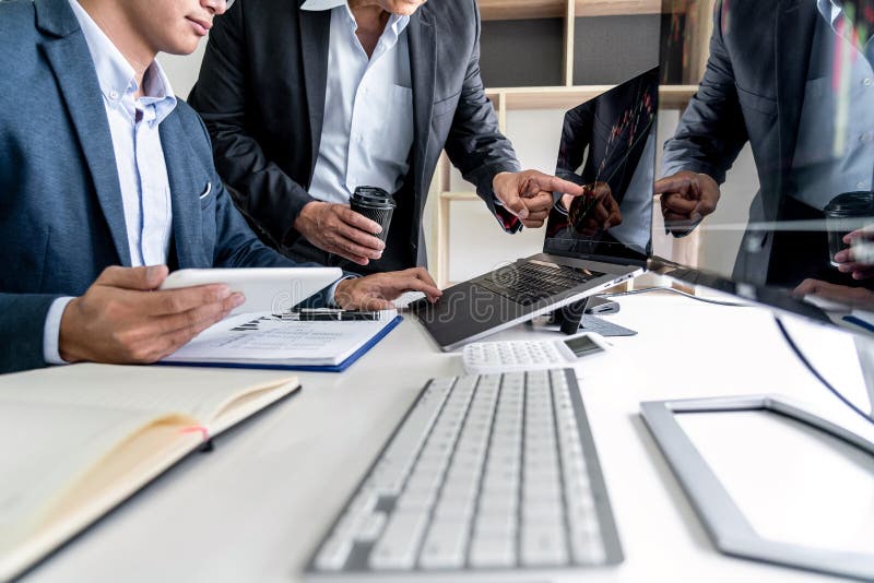 Business team investment working with computer, planning and analyzing graph stock market trading with stock chart data, business royalty free stock images Business team investment working with computer, planning and analyzing graph stock market trading with stock chart data, business royalty free stock images