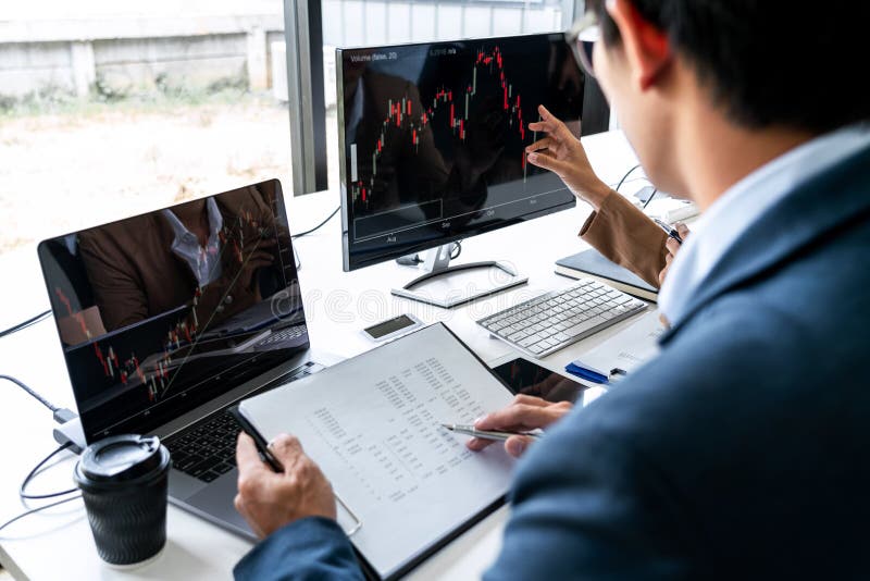 Business team investment working with computer, planning and analyzing graph stock market trading with stock chart data, business stock photo Business team investment working with computer, planning and analyzing graph stock market trading with stock chart data, business stock photo