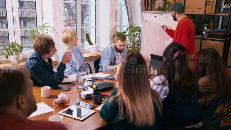 Business team meeting around table in modern office stock image