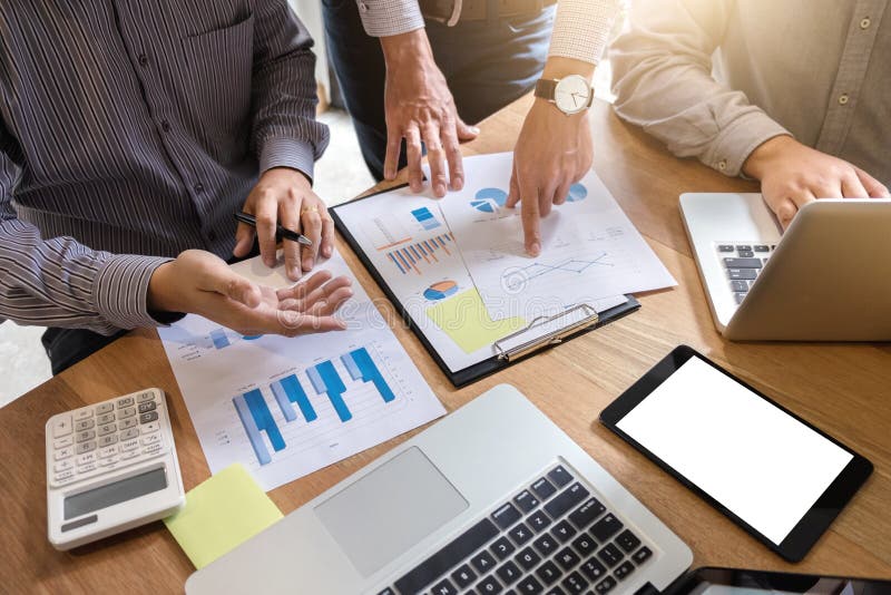 Business team meeting working with new startup project, discussion and analysis data the charts and graphs. Digital stock image