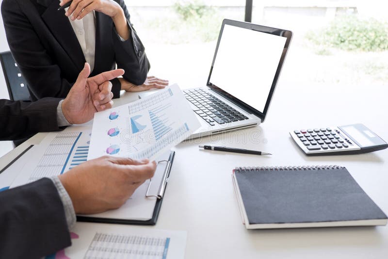 Business team partner meeting working and negotiation analyzing with financial data and marketing growth report graph presentation stock photo