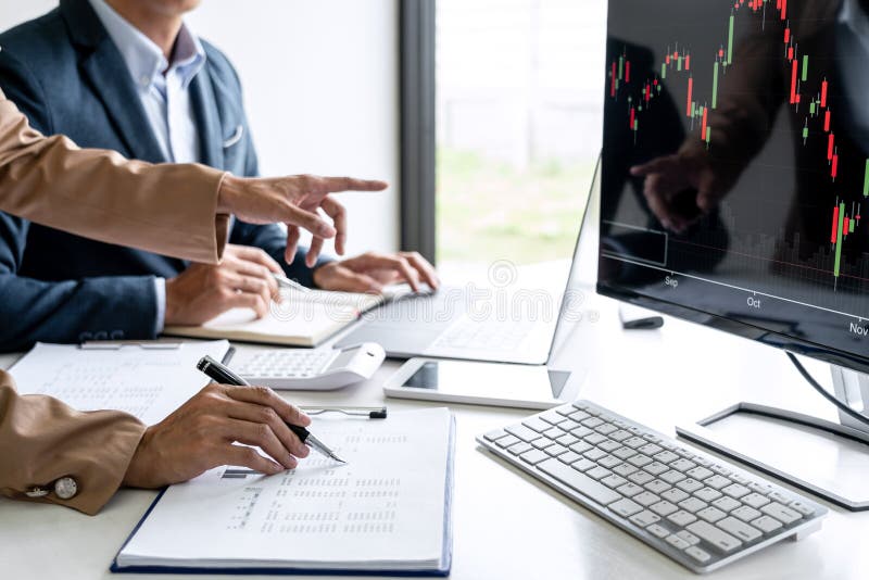 Business team partner working with computer, laptop, discussion and analyzing graph stock market trading with stock chart data royalty free stock photos Business team partner working with computer, laptop, discussion and analyzing graph stock market trading with stock chart data royalty free stock photos