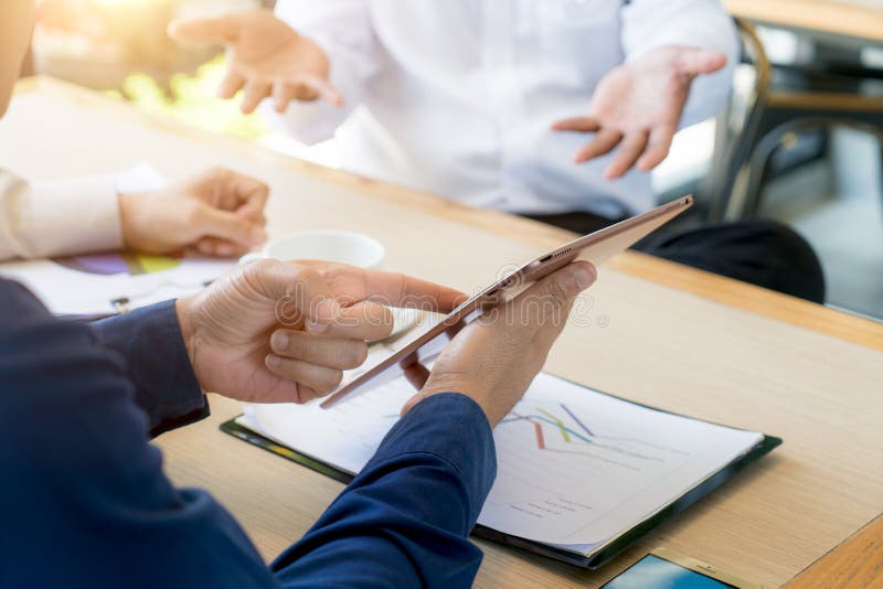 Business team present. Photo professional investor working new s stock photos Business team present. Photo professional investor working new s stock photos