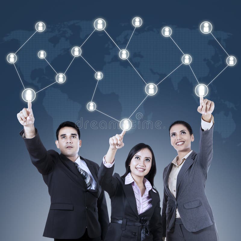 Business team pressing a Social Network button royalty free stock images