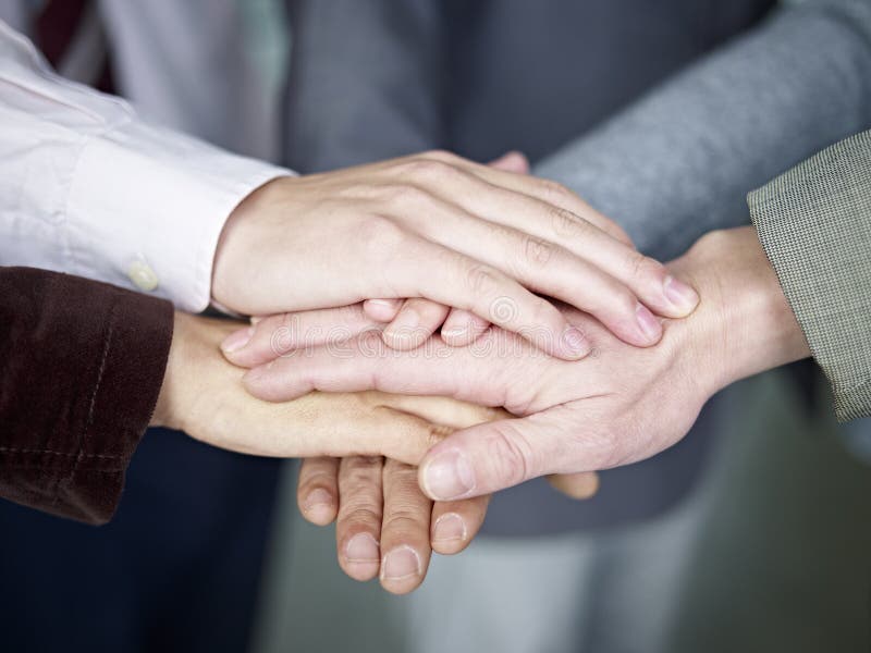 Business team putting hands together royalty free stock photos Business team putting hands together royalty free stock photos