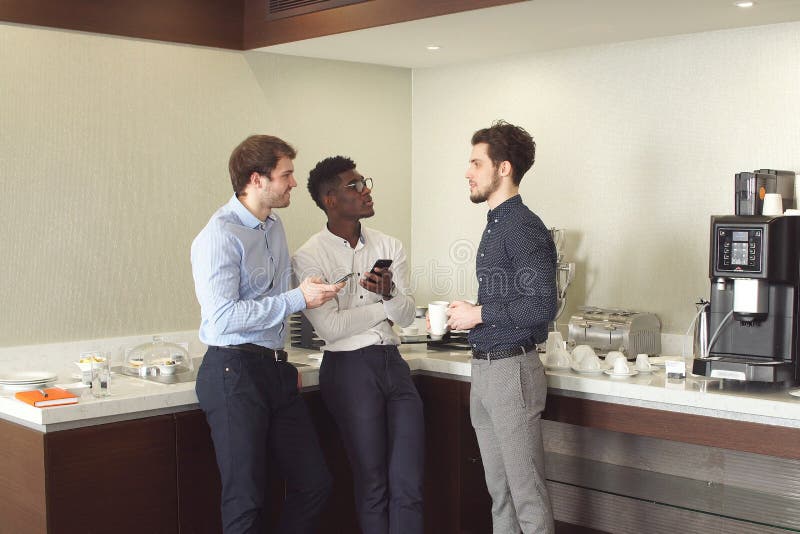 Business team sharing experience while drinking tea royalty free stock image Business team sharing experience while drinking tea royalty free stock image