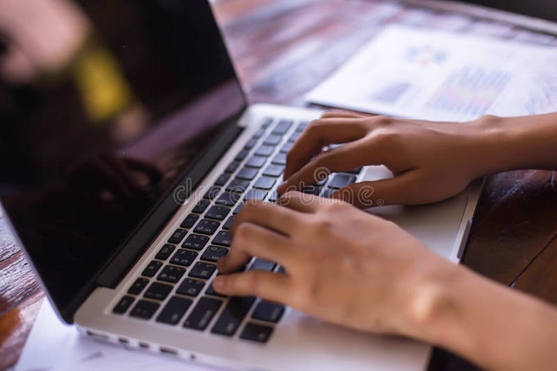 Business team working on laptop, while sitting at office. Business people stock photos Business team working on laptop, while sitting at office. Business people stock photos