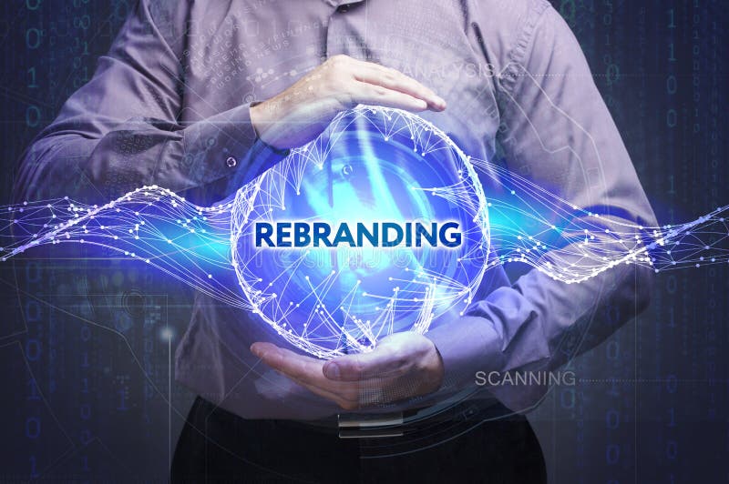 Business, Technology, Internet and network concept. Young businessman shows the word: Rebranding