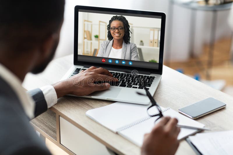 Business Video Call. Black Male Entrepreneur Having Online Meeting With Female Colleague