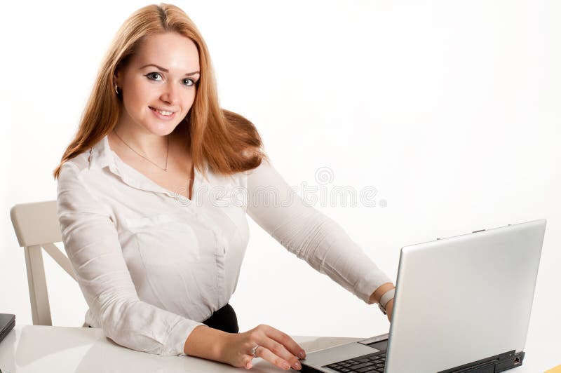 Business woman at desk with a laptop