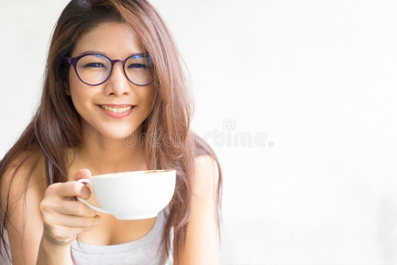 Business woman drinking coffee on white background. Happy young stock photos Business woman drinking coffee on white background. Happy young stock photos