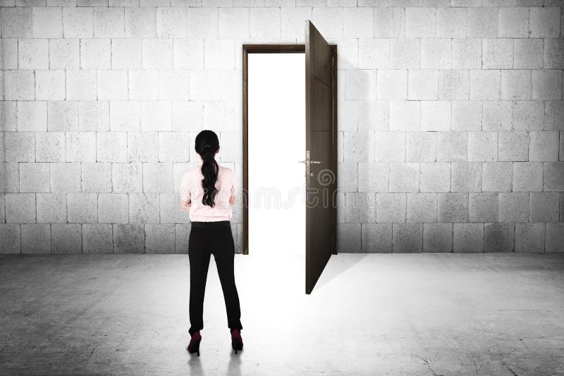 Business woman going to the open door royalty free stock image Business woman going to the open door royalty free stock image