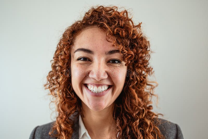 Business Woman Having Fun Looking in Front of Camera in Office Stock
